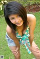 A young woman with braces posing for a picture.