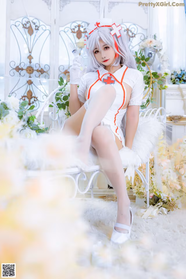 A woman dressed as a nurse sitting on a white chair.