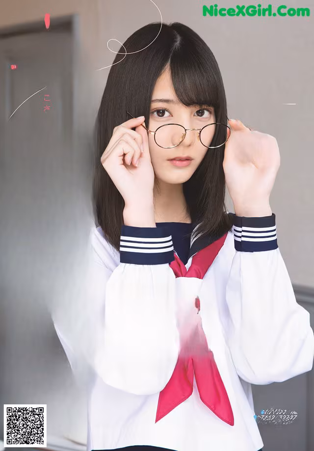 A woman in a school uniform holding a pair of glasses.