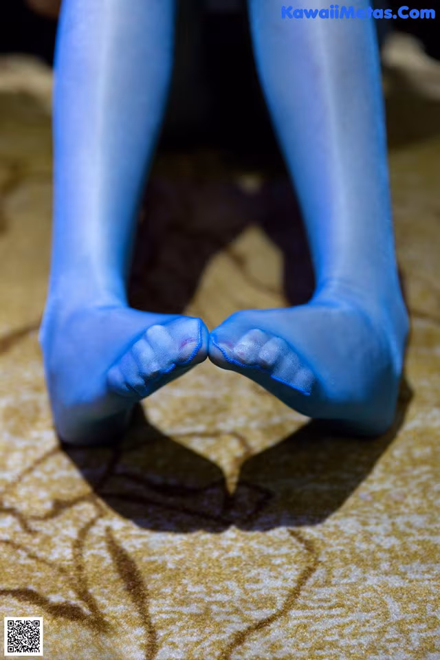 A pair of blue tights that are on the ground.
